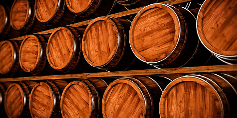 barrels of alcohol sitting on shelves